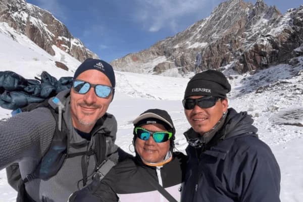 Three-trekkers-taking-a-selfie-in-snowy-Himalayan-mountains