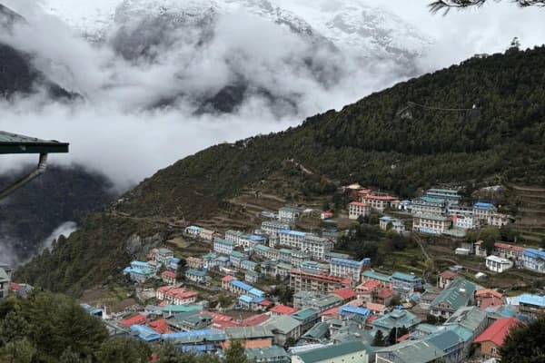 namche-bazaar-village-with-clouds-and-mountain-hillside-in-everest-region