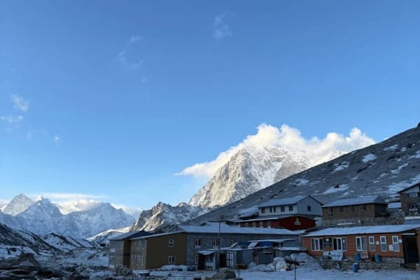 small village in mountain region surrounded by snow cover mountain