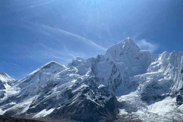 snow covered peaks of mount everest under a clear blue sky