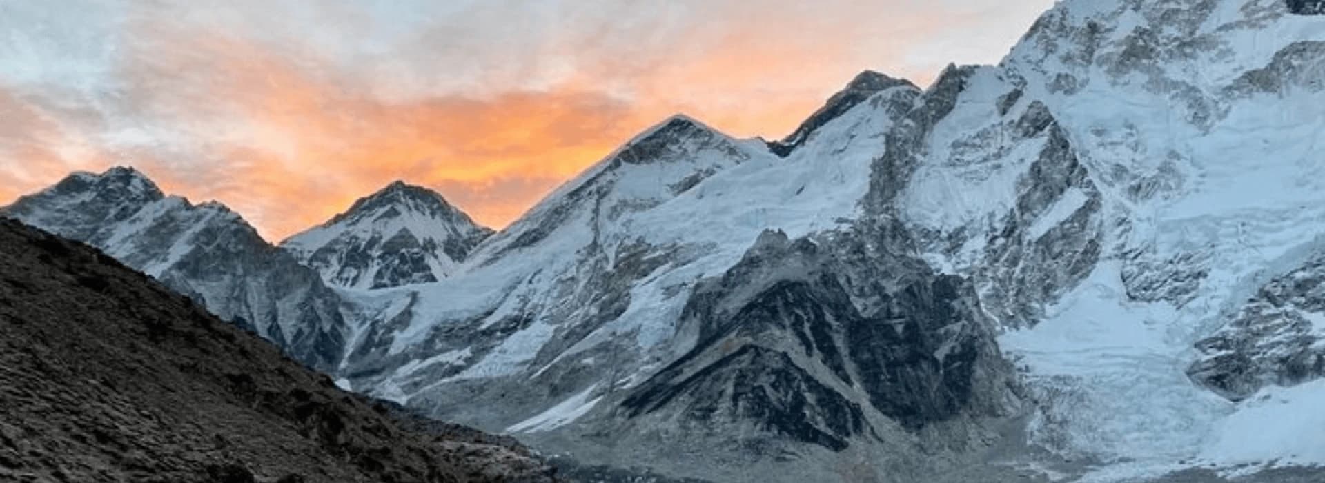 sunrise view of Mount Everest and Himalayan peaks from the Everest Base Camp trekking route