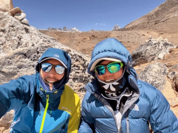 Two-trekkers-taking-a-selfie-on-the-Three-Passes-Trek-in-Nepal